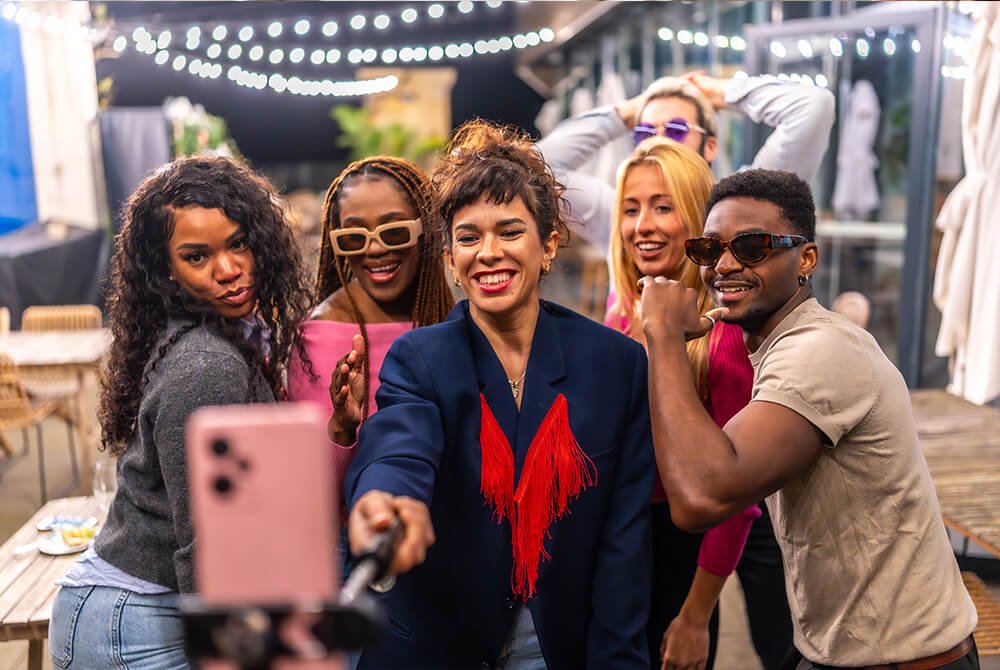 Group of friends taking a selfie at an outdoor event