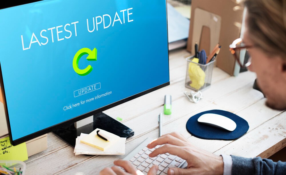 Man viewing latest software update on computer screen